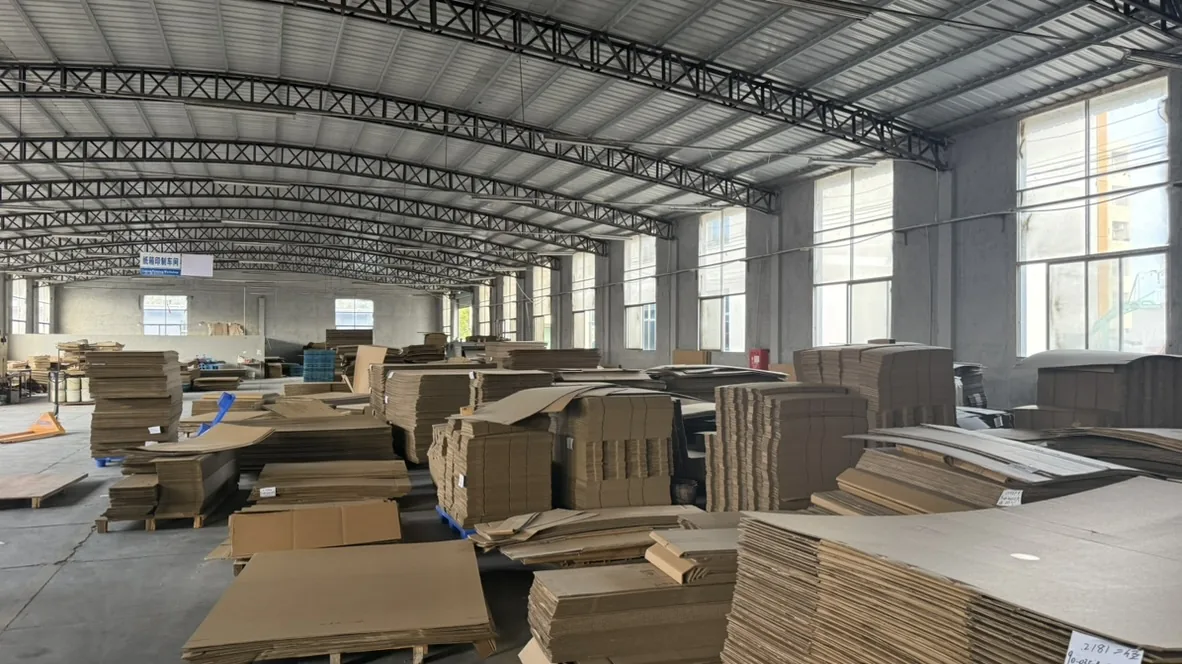 Stacks of packaging cardboard and shaped cardboard pieces