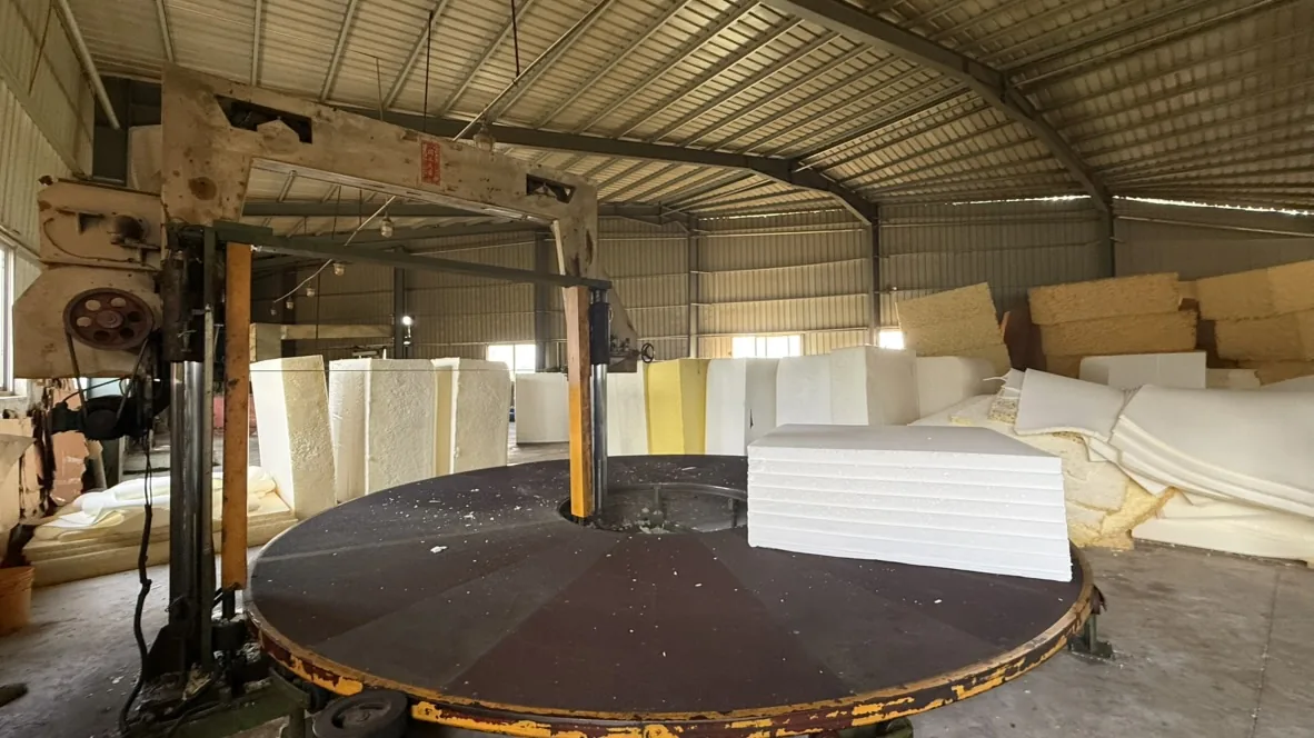Round worktable and overhead equipment in the foam area