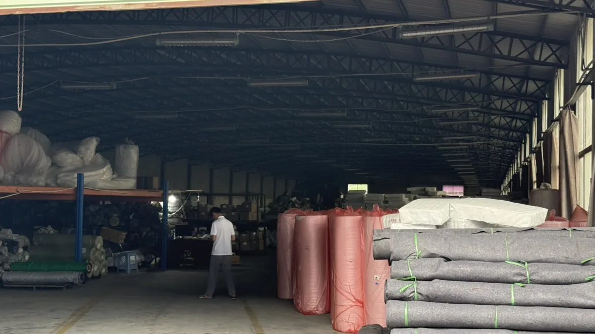 Red and grey rolls of material stored indoors