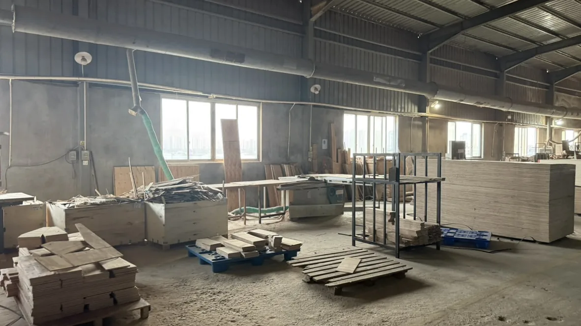 Woodworking equipment and panels beneath dust-extraction ducts