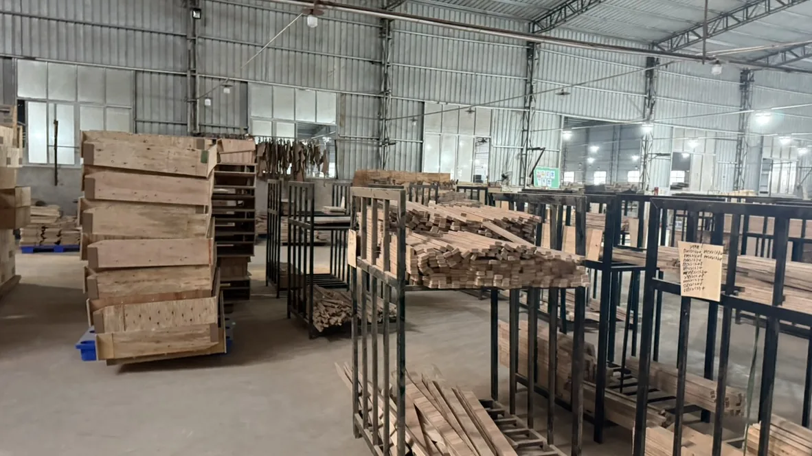 Long wood-strip carts and wooden frames in the materials area