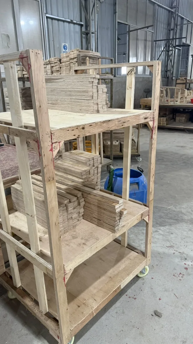 Portrait view of panels in tiers on a wooden cart