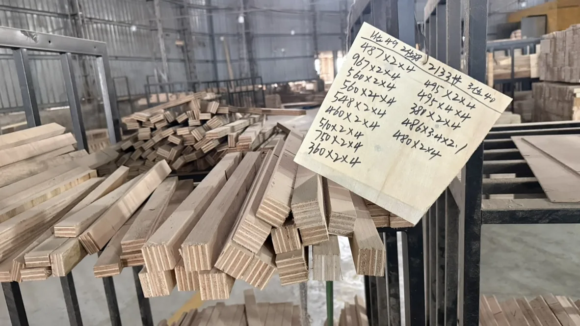 Close-up of wood strips and a handwritten dimension list