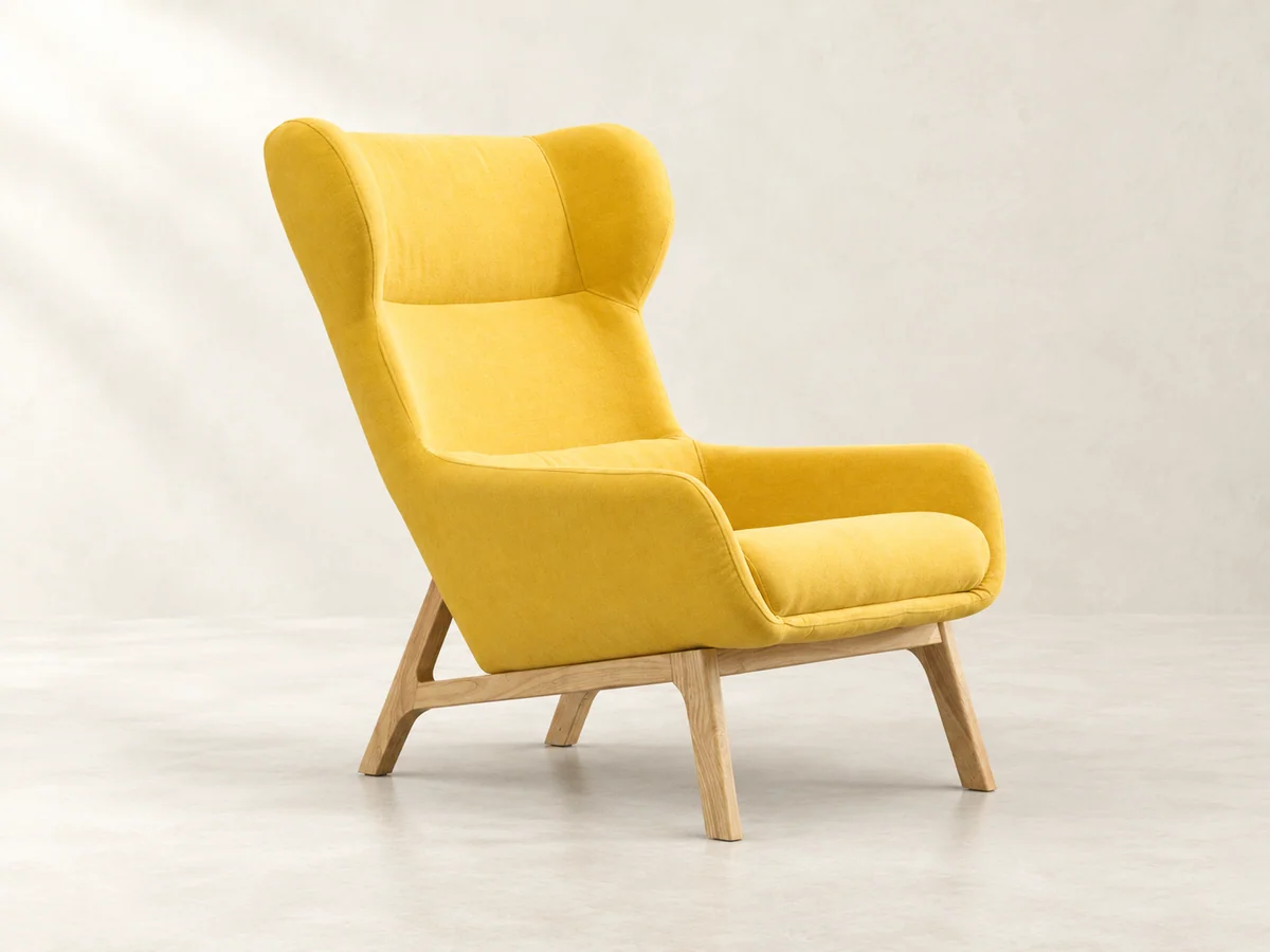 Yellow wingback chair with wood legs in soft studio light