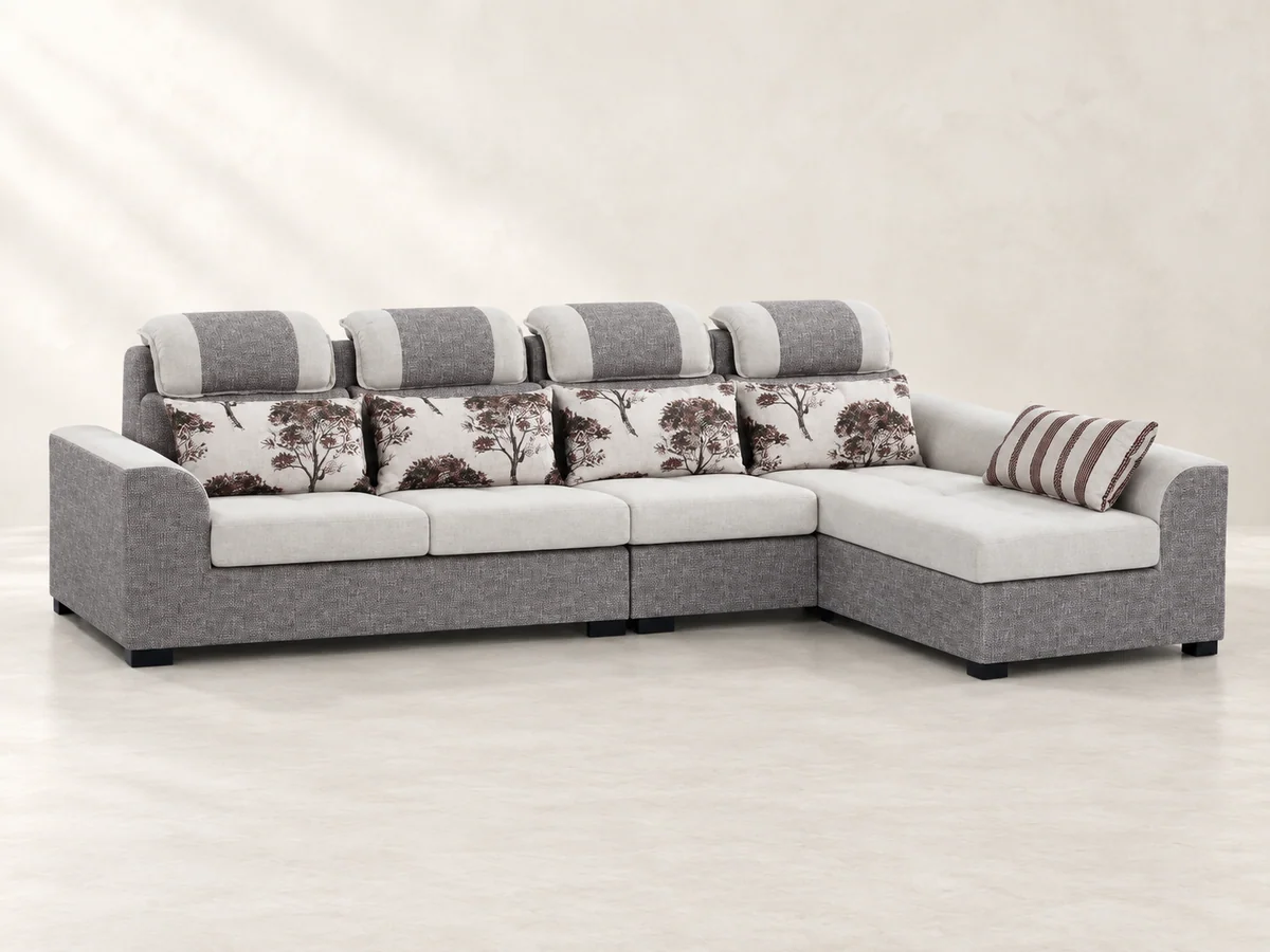 Grey L-shaped sofa with headrests and patterned back cushions