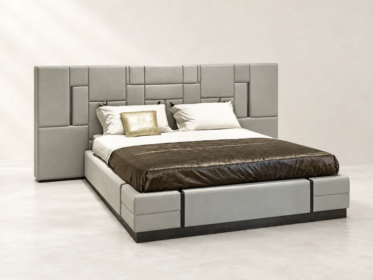 Light upholstered bed with a geometric panelled headboard and styled bedding