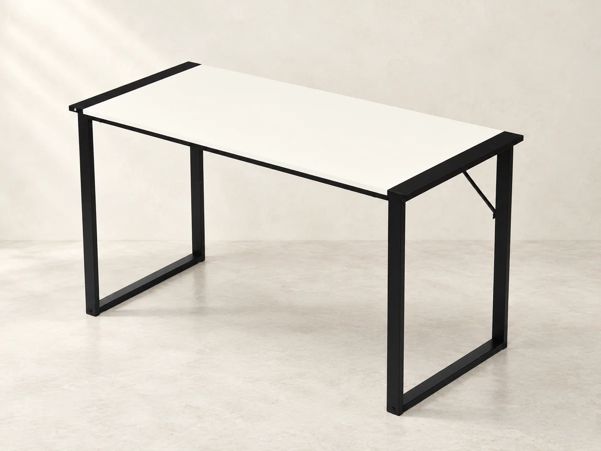 Pale rectangular desk with open black steel side frames